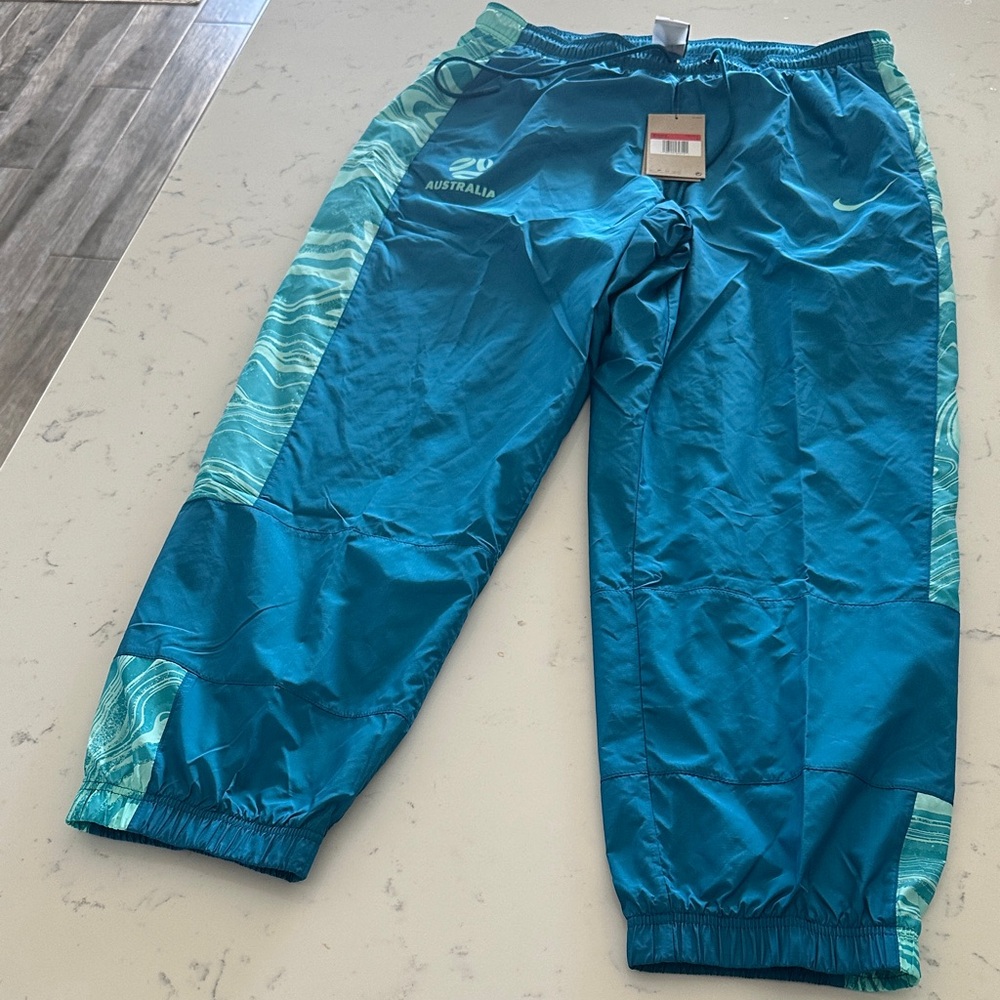 Nike women’s large Australia track pants Teal and Aqua NWT